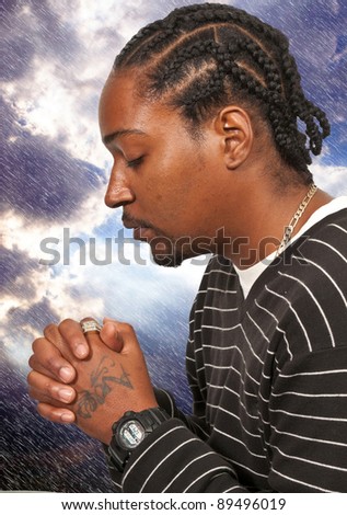 Black African American Christian man in deep prayer