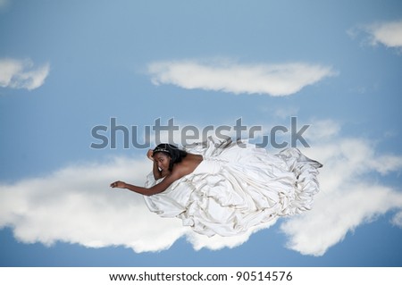 Black African American Woman Bride in a wedding dress on a cloud