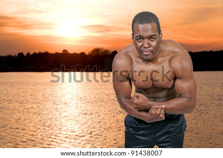 Young African American black man with his shirt removed