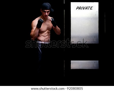 Attractive man athletic boxer in a fighting stance