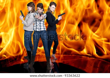 Beautiful police detective women on the job with guns in a fire