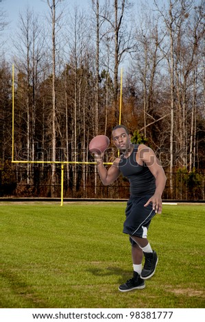 Black African American man playing a game of football