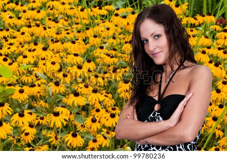 Woman with the common wild flower known as a Black Eyed Susan.