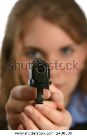 stock photo : attractive young lady aiming handgun, gun in focus