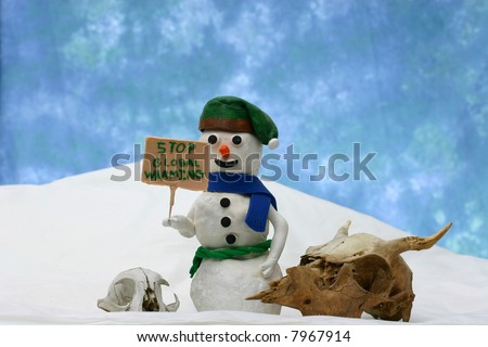 Snowman and animal skulls with a sign calling for an end to global warming