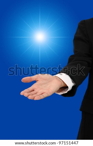 Hand of business man give light of chance.