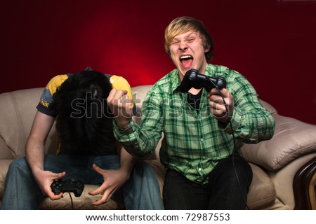 Good friends playing video games on a red background
