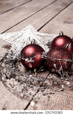 Red Christmas balls and white star on the wooden floor. Copy space