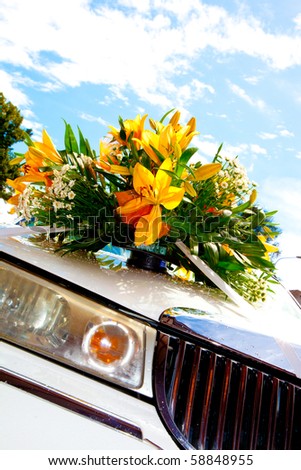 close-up of vintage wedding, car decorated with wedding flowers