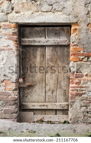An old wooden door of a run down house
