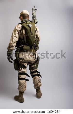desert storm soldier in the army dressed in camo back view