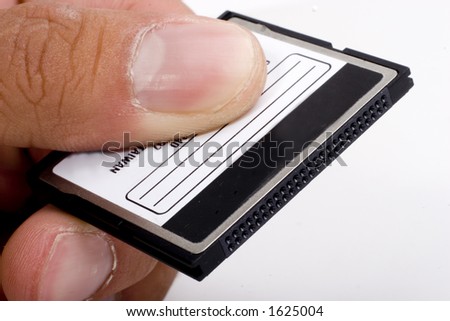 hand holding compact flash memory