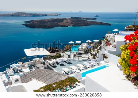 Luxury hotel with sea view. White architecture on Santorini island, Greece. Beautiful view on the sea