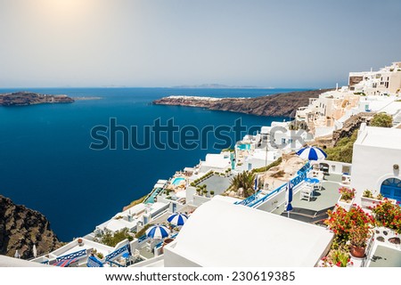 Luxury hotel with sea view. White architecture on Santorini island, Greece. Beautiful landscape with sea view.