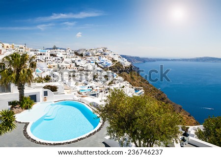 White architecture on Santorini island, Greece. Swimming pool in luxury hotel. Beautiful view on the sea