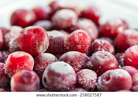 Frozen cherry berries. Macro image with small depth of field. Beautiful berries background