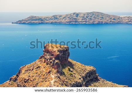 Cliff by the sea. Beautiful view of the sea and islands. Santorini island, Greece.