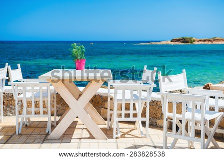 Cafe on the beach. Malia, Crete island, Greece. Beautiful tropical beach with turquoise water