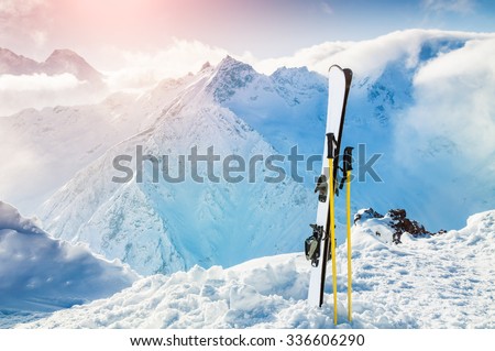 Winter mountains and ski equipment in the snow. Skiing, ski resort, winter holidays.