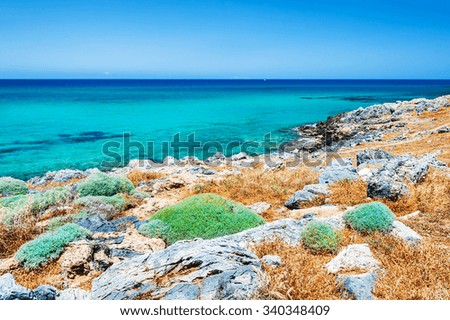 Beautiful beach with turquoise water and volcanic stones. Crete island, Greece.