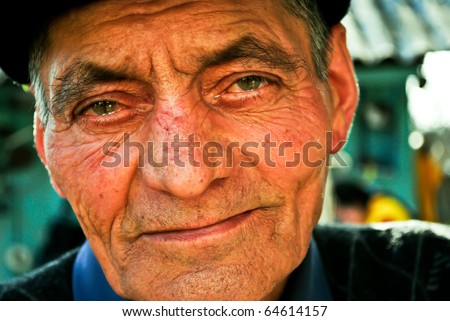 Portrait of an old man with teary eyes