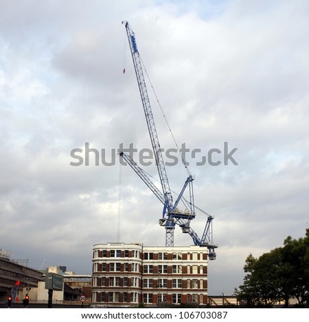 Building in London with a crane in the background