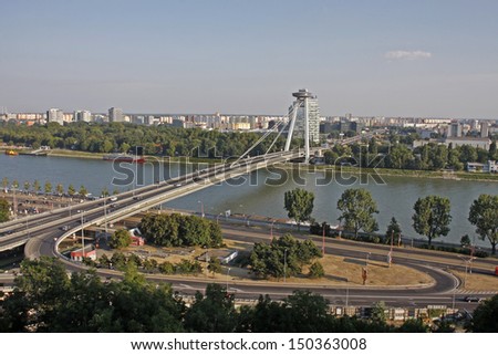 BRATISLAVA - JULY 27: The New Bridge ( NovÃ?Â½ most ) in Bratislava on July 27, 2013. The bridge was built between 1967 and 1972 and named the Bridge of the Slovak National Uprising