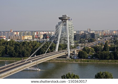 BRATISLAVA - JULY 27: The New Bridge ( NovÃ?Â½ most ) in Bratislava on July 27, 2013. The bridge was built between 1967 and 1972 and named the Bridge of the Slovak National Uprising