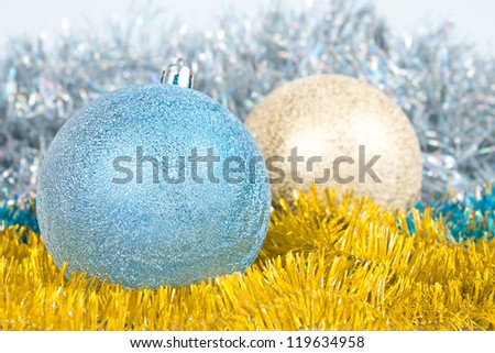 Christmas background with a blue and gold balls and a tinsel