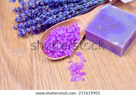 A lavender bouquet and a handmade soap on a wood background