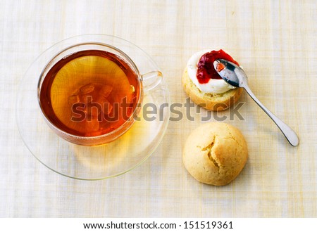 Cream Tea. Cup of tea and scones with clotted cream and jam
