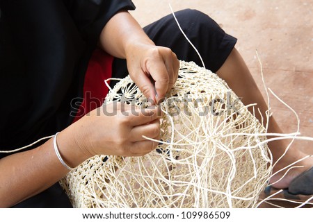 Thai artisan making basket