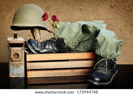 Still Life Art Photography On Vintage Army Concept With Helmet Jungle Boots And Metal Bullets Box Pistol And Dry Rose