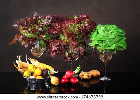 Still life art photography of mixed vegetables with wine glasses