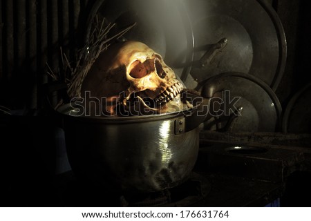 Still life fine art photography on boiled human skull in dirty kitchen