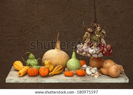 Still life art photography on human skull calabash bottle Gourd onions and pumpkins on grunge background