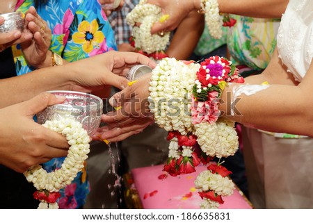 Thai people celebrate Songkran the new year water festival  by giving garlands to their seniors and asked for blessings