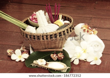Still life art photography on spa concept with oil treatment herbal massage balls exfoliation salt scrub and spa accessories