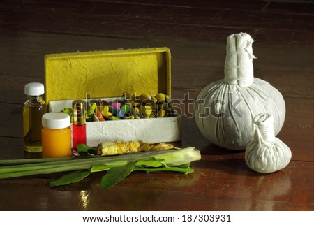 Still life art photography on spa concept with oil treatment herbal massage balls exfoliation salt scrub and spa accessories