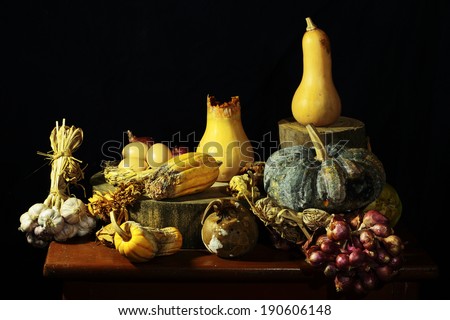 Expired pumpkins with garlic eggs as still life art photography