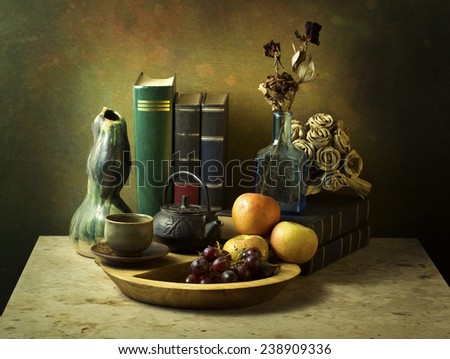Still life art photography with books fruits roses on marble table