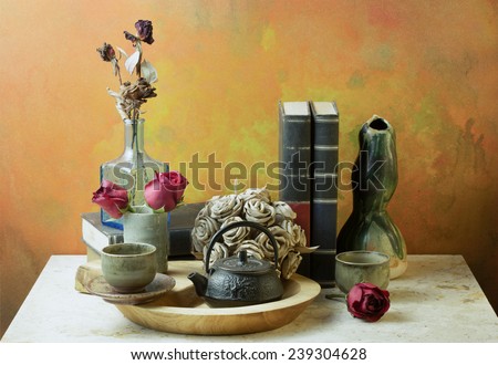 Still life art photography with books roses on marble table