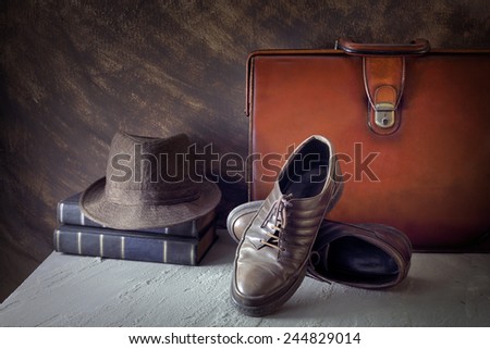 Still life art on casual concept with hat book leather bag shoes