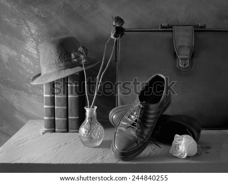 Still life art on casual concept with hat book leather bag shoes black and white version