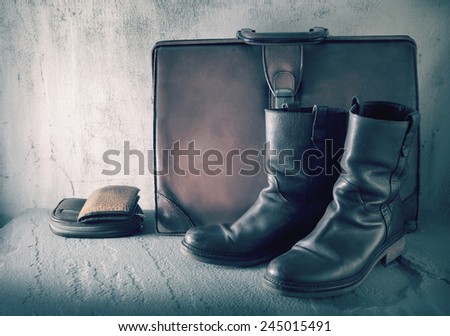 Still life art on casual concept with boots wallet purse case