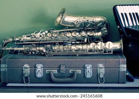 Still life vintage music  on musical instruments with saxophones and accordion background black and white version