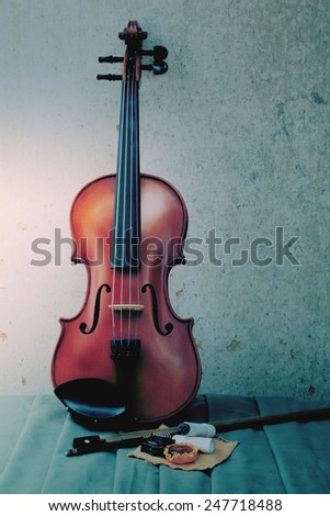 Still life art photography on violin bow and rosin on grunge background