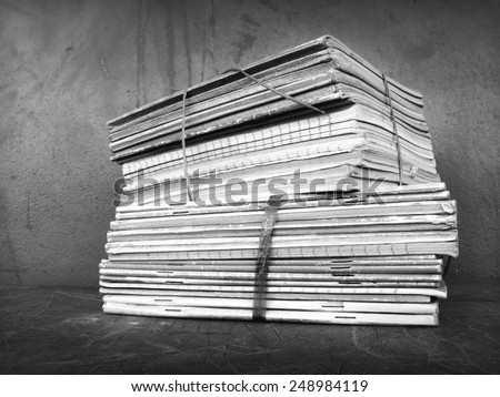 Abandon old student work books in classroom black and white