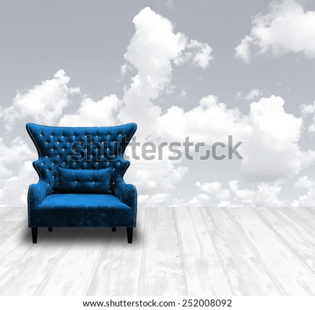vintage luxurious armchair on wood panel at white pale with fluffy cloud sky background