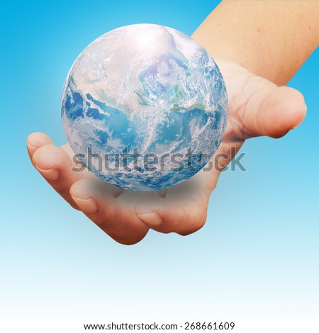Human hands palm up with NASA global image as design element over white